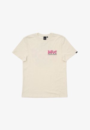 Cream cotton t-shirt with short sleeves, featuring pink "DEUS CUSTOM BOARDS" text on the front and a textured round graphic.