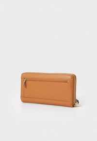 Tan leather wallet with a textured finish, featuring a front zip pocket, gold hardware accents, and a zip-around closure.