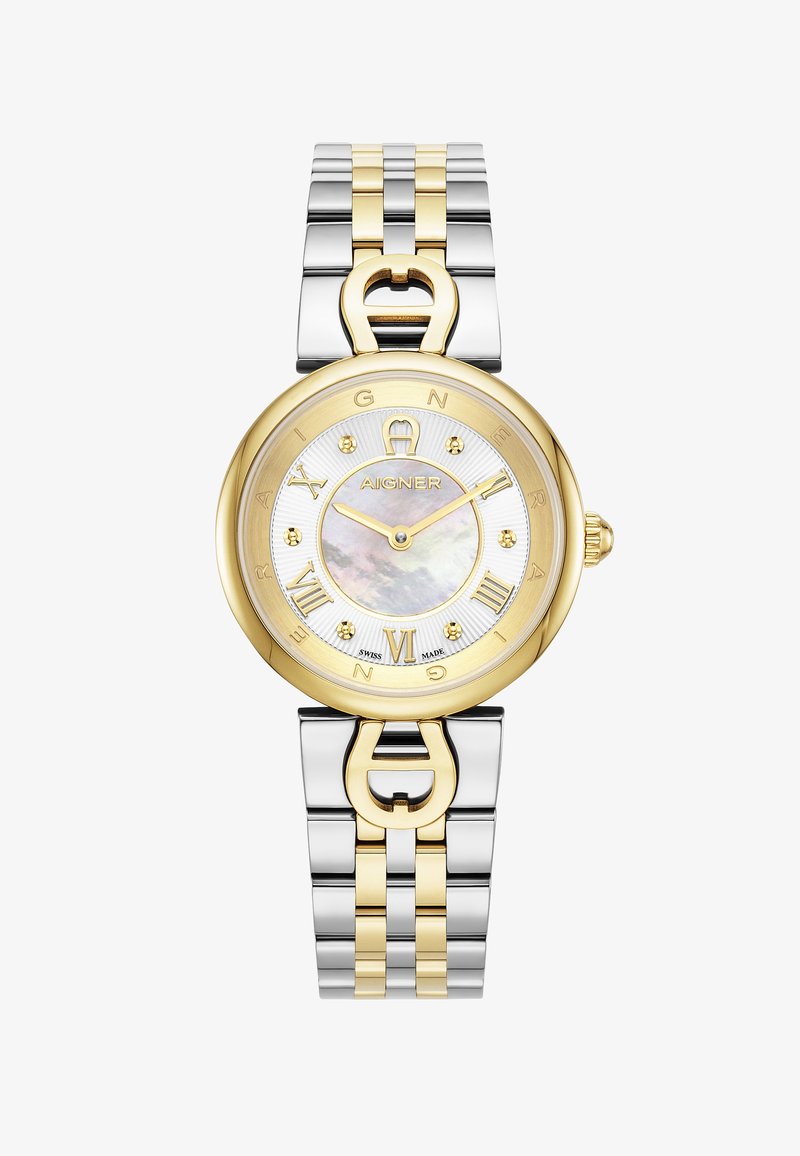 Reloj bicolor de oro y plata con una esfera redonda de nácar, números romanos y un detalle de cierre en forma de corazón en la correa.