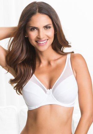 Soutien-gorge bianco con pannelli in rete trasparente a forma triangolare, spalline regolabili e un fiocco decorativo al centro. Tessuto liscio e design classico.