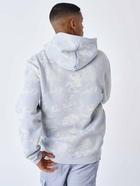 Felpa con cappuccio grigio chiaro che presenta un motivo floreale e mitologico tono su tono e testurizzato. Ha un cappuccio ampio e polsini e orlo a coste.