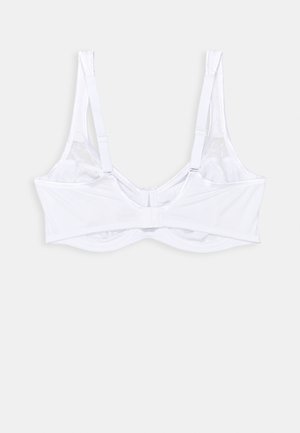 Balta krūštura ar regulējamiem siksniņām, bezvadu dizains, gluda faktūra un aizdare aizmugurē. Iezīme ir vienkārša un tīra estētika.