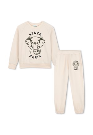 Ensemble sweat-shirt et pantalon de jogging couleur crème avec tête d'éléphant noire et texte ""Kenzo Paris"" sur le devant des deux pièces.