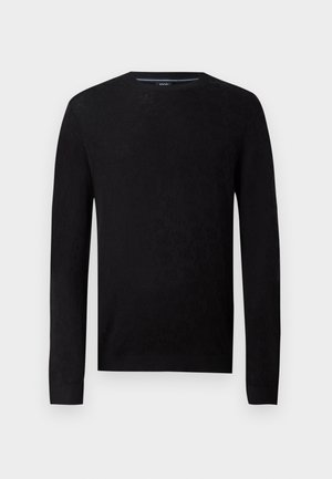 Melna jaka ar apaļu kakla izgriezumu un garām piedurknēm. Tam ir strukturēts ornaments un riboti gali, kas nodrošina pieguļošu siluetu.