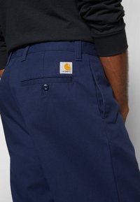 Carhartt WIP CALDER PANT - Calças - dark navy rinsed