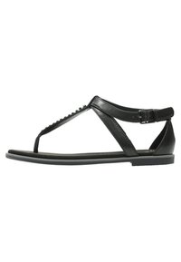 Sandalo in pelle nera con design a T, suola piatta, fibbia regolabile alla caviglia e perline decorative lungo la fascia.