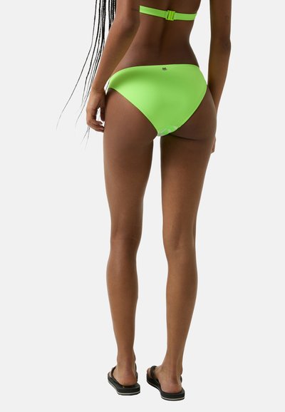 Neon zelené bikinové kalhotky s hladkým texturem, středním pokrytím a nízkým pasem. Nastavitelný popruh na odpovídajícím bikinovém topu.