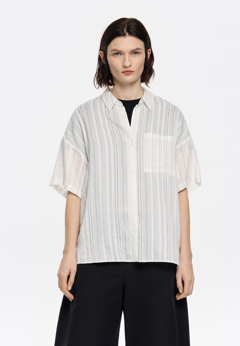 Lightweight, button-up shirt featuring vertical light gray and white stripes, short sleeves, and a chest pocket. Smooth texture.