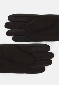 Black gloves made of smooth, stretchy fabric with textured grip accents on the palms. Designed with five fingers and a snug fit.