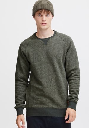 Grønne tekstureret sweatshirt med rund hals, med raglanærmer og ribbede manchetter, parret med en matchende ribbet hue.