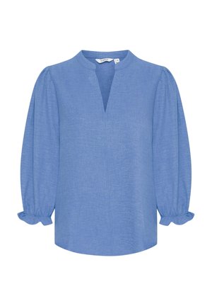 Blusa azzurro chiaro in lino con una vestibilità comoda, caratterizzata da un collo rotondo, maniche a metà con polsini elasticizzati e un dettaglio con spacco frontale.