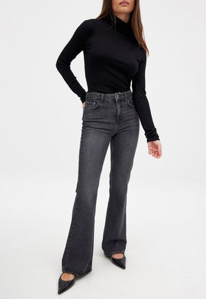 Džinsi ar paplatinātiem galiem - dark grey
