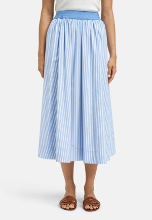 Blue and white vertical striped midi skirt with elastic waistband, worn with a white top and brown flat sandals.