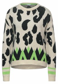 Beige tröja med svart djurmönster, med ett grönt zigzagmönster nederst och gröna ränder på ärmarna. Stickad struktur.