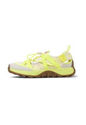 Sport shoe with a lightweight design, featuring a neon yellow upper, textured beige accents, and a rubber outsole with grip pattern.