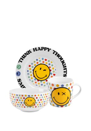White plate, bowl, and mug with colorful smiling and winking faces; plate reads "Think Happy Thoughts" around the rim.