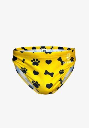 Gele zwembroek met zwarte pootafdrukken, hartjes- en botjespatronen en een "MR UKKO"-logo aan de voorkant aan de rechterkant.