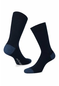 Granatowe skarpetki bawełniane z kontrastującymi jasnoniebieskimi akcentami na pięcie i palcach. Posiadają ściągacz oraz nadrukowane logo na podeszwie.
