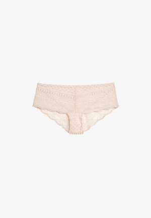 Culottes hippie pour femmes en dentelle beige clair avec motifs floraux et géométriques, bords en forme d'ondulations et taille basse.