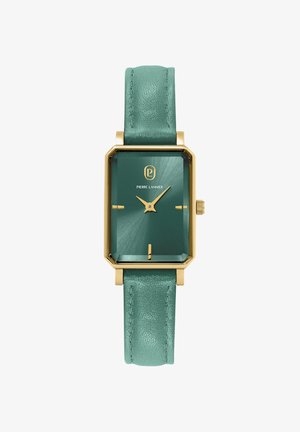 Stačiakampis laikrodis su auksinės spalvos metaliniu korpusu ir melsvo žalio odiniu dirželiu. Ciferblatas pasižymi struktūruota melsvo žalio paviršiumi ir auksinėmis rodyklėmis.