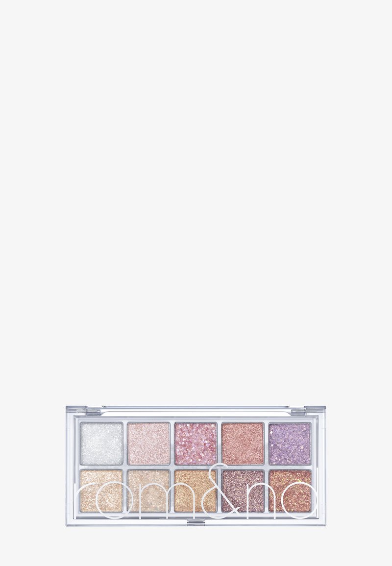 Palette di ombretti glitterati con otto cialde rettangolari in tonalità di argento, rosa, oro e viola. Confezione trasparente con il logo del marchio sulla parte anteriore.