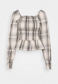 Krämsfärgad och svart rutiga topp med fyrkantig halsringning, långa puffärmar, smockad kjol och volangkant. Ingen märkbar hårdvara eller detaljer.