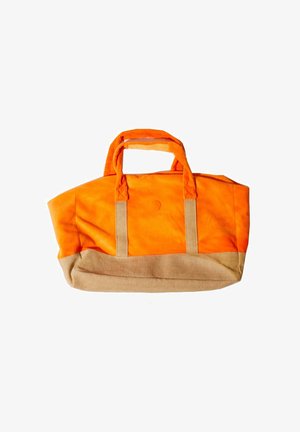 Orange and beige canvas duffel bag with dual handles, rectangular base, and soft fabric texture.