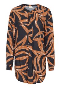 Chemise à manches longues en bleu marine foncé avec un motif de feuilles orange et blanc audacieux, dotée d'un bouton sur le devant et d'un ourlet arrondi. Fabriquée en tissu léger.