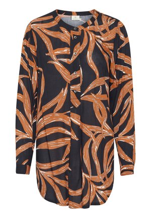 Chemise à manches longues en bleu marine foncé avec un motif de feuilles orange et blanc audacieux, dotée d'un bouton sur le devant et d'un ourlet arrondi. Fabriquée en tissu léger.