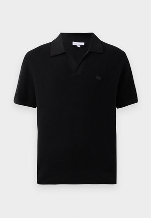 Polo shirt nero a maniche corte con design a V, texture a costine e un piccolo logo tonale sul petto. Finitura in tessuto liscia.