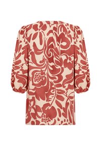 Red floral pattern on a cream background, with puffed sleeves and a round neckline. Soft fabric with a flowing design and gathered back detail.
