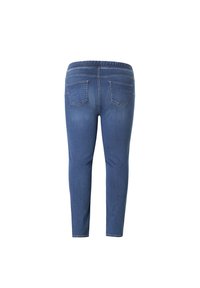 Jeansleggings in medium blauw met een elastische tailleband. Beschikt over twee achterzakken en een slim fit, een gladde structuur en rekbare stof.