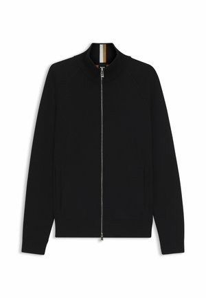 Zwarte zip-up jack met een geribbelde kraag, raglanmouwen, twee zijzakken en een soepele textuur. Heeft een contrasterende binnenkraag.