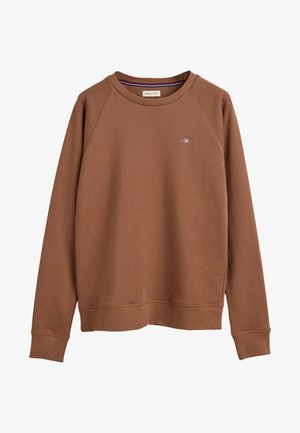 Sweatshirt brun avec des poignets et un ourlet côtelés. Arbre avec un petit logo sur la poitrine. Fabriqué en tissu doux avec un design classique à col rond.