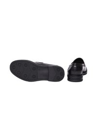Scarpe in pelle nera con punta arrotondata, superficie liscia e suola in gomma con motivo. Presentano un tacco basso e accenti decorativi.
