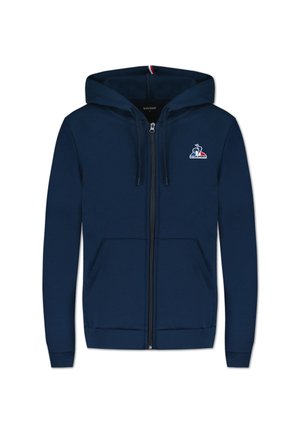 Navy zip-up hoodie made from cotton blend, featuring a front logo, two side pockets, and ribbed cuffs and hem. Soft texture.