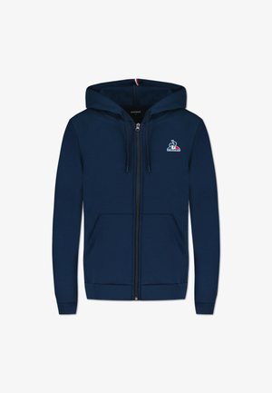 Sweat à zip bleu marine en mélange de coton, avec un logo sur le devant, deux poches latérales et des poignets et un ourlet côtelés. Texture douce.