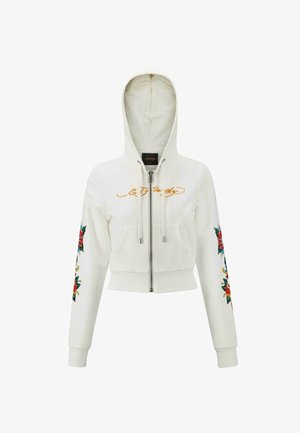White cropped hoodie with a front zipper, gold text detailing, and floral designs in red and green on the sleeves. Soft, smooth fabric.