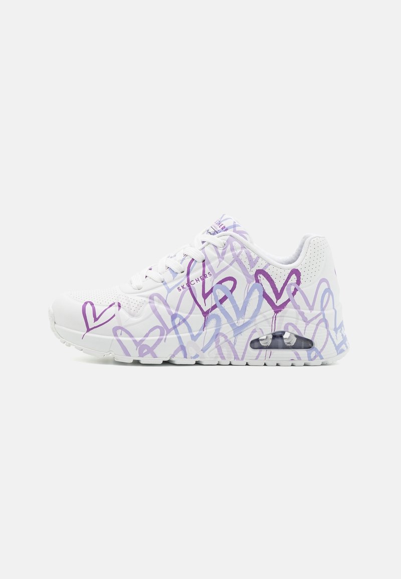 White athletic shoe featuring purple and blue heart patterns, perforated accents, and a visible air cushion in the sole for comfort.