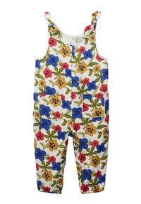 Salopette sans manches pour enfants avec des bretelles nouées, des chevilles élastiques, des poches avant et un motif floral rouge, bleu et jaune sur un tissu blanc.
