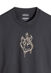 Graphic gray t-shirt made of cotton, featuring a beige flame design with a heart and "OFF THE WALL" text printed on the front.