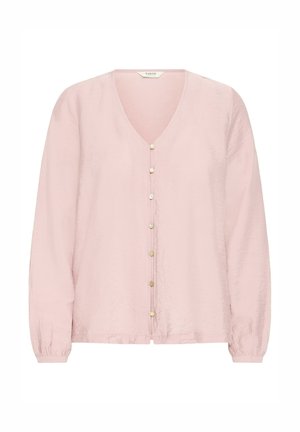 Blusa de manga larga rosa claro con escote en V y ocho pequeños botones dorados en la parte delantera, con puños fruncidos.