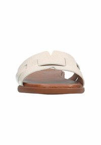 Flat sandal with a textured light beige upper and a brown sole. Features cut-out design and a smooth finish. Open-toe style.