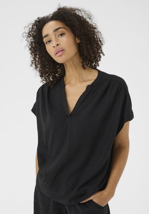 Black short-sleeve blouse with a v-neckline, featuring loose fit, soft texture, and gathered detailing at the shoulders.