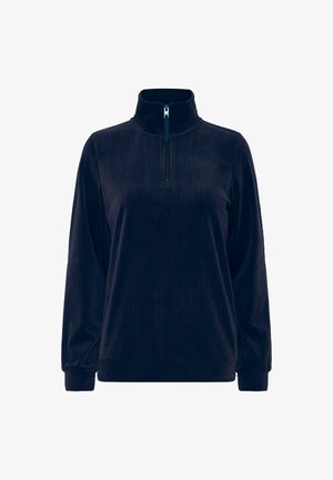 Pull en bleu marine, côtelé, avec col montant et fermeture éclair mi-haute. Manches longues et poignets ajustés ; fabriqué en tissu doux et texturé.