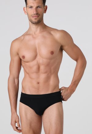 Slip neri da uomo con una texture liscia e una cintura ampia, caratterizzati da cuciture minime e un taglio aderenza per comfort e supporto.