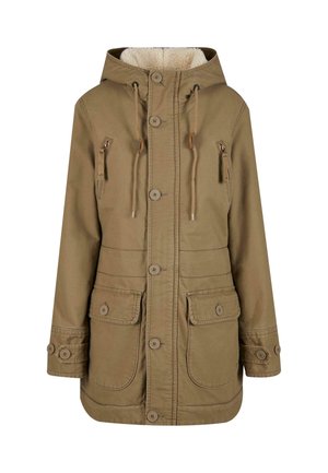 Khaki parka jaka ar kapuci, ar mīkstu iekšējo oderi, pogu priekšpusi un vairākām priekšējām kabatām. Izgatavota no izturīga kokvilnas materiāla.