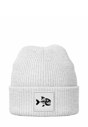White ribbed beanie with a folded cuff, featuring a black fish skeleton graphic on a white patch. Soft texture, close-knit design.