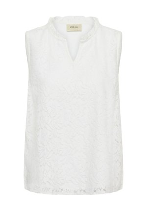 Blouse blanche sans manches en dentelle à motif floral avec une petite ouverture en V, étiquette "CREAM" à l'intérieur du col.