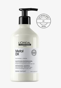 Shampoo L'Oréal Professionnel Metal DX dans une bouteille blanche cylindrique haute avec une pompe noire, avec un texte épuré et un logo circulaire. 500 ml.